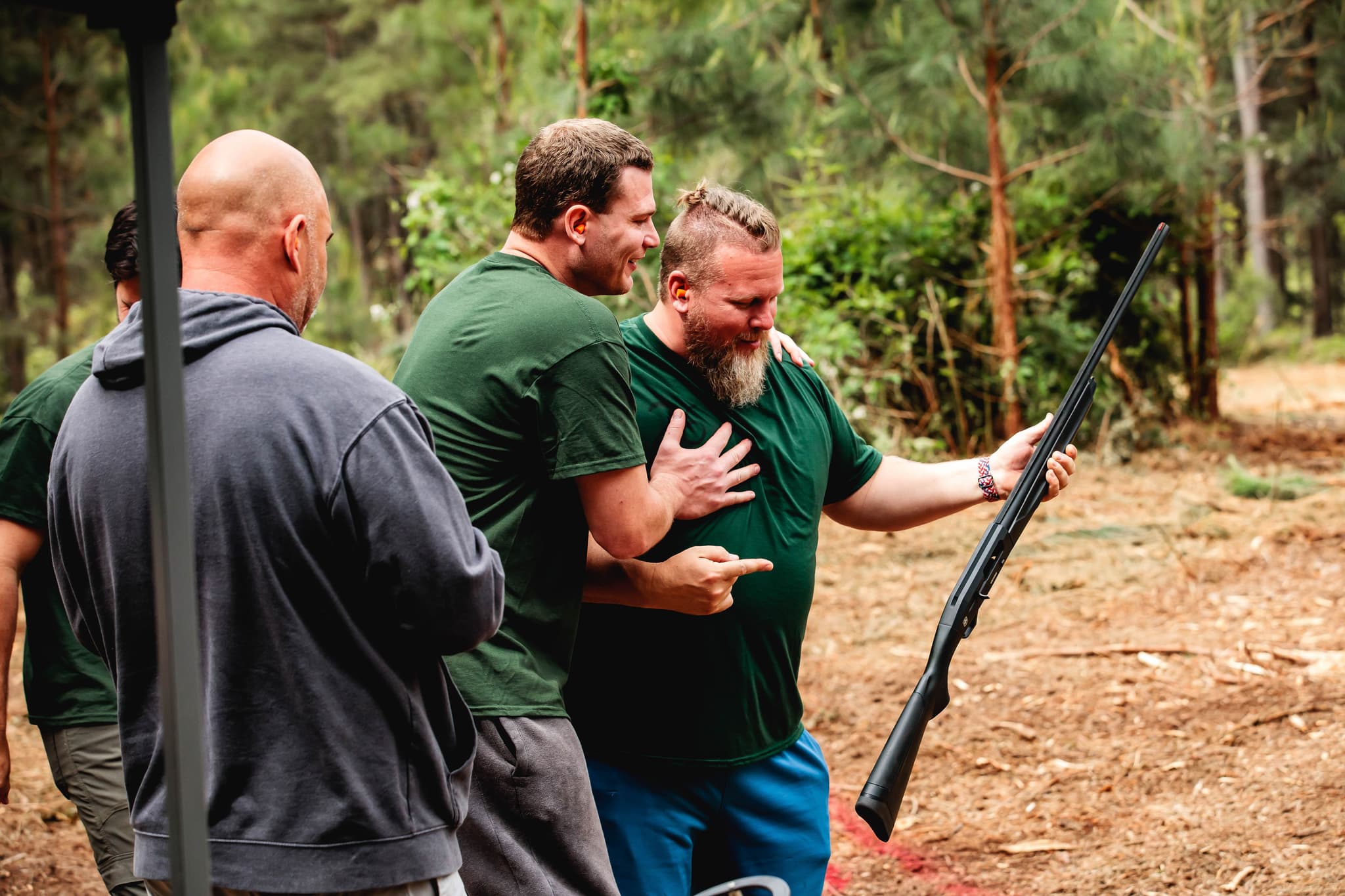 Men carrying each other